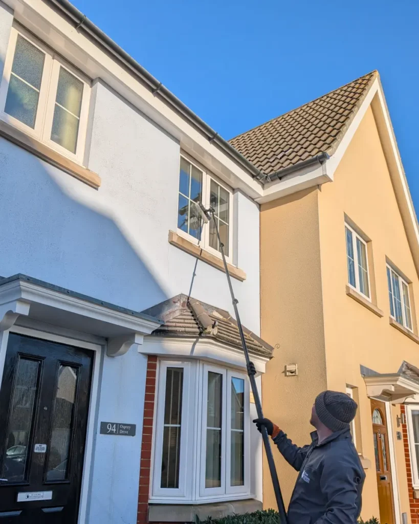 Pure Horizon window cleaner using a water-fed pole on a home in Stowmarket