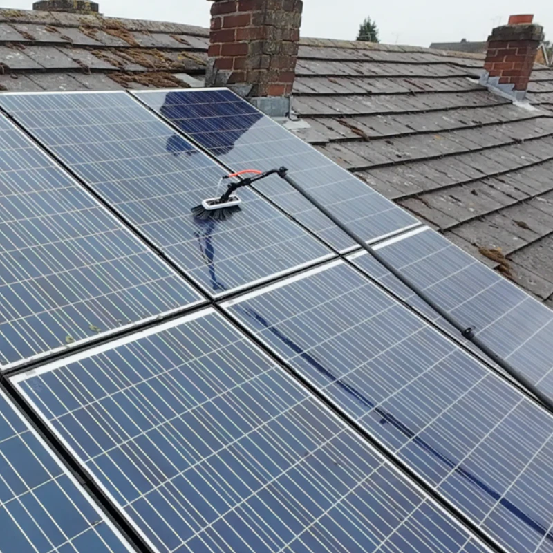 Solar panels being professionally cleaned using a pure-water cleaning system